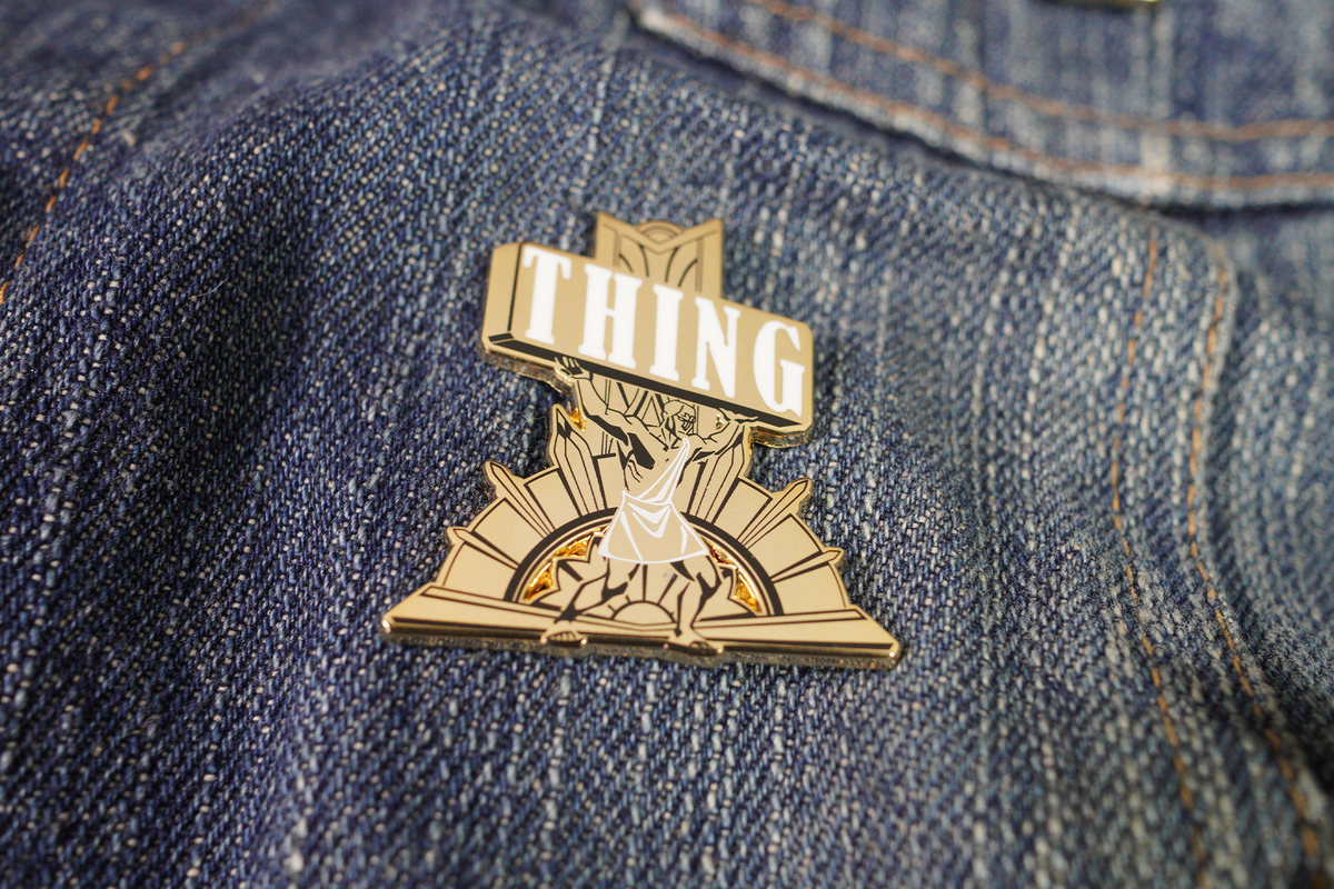 ManCarryingThing Pin